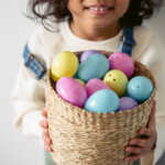 girl holding basket of Easter eggs